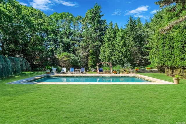 view of pool featuring a pergola and a lawn