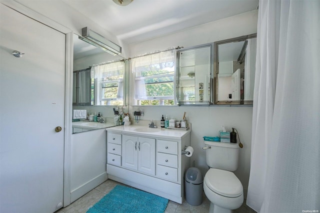 bathroom with tile patterned floors, vanity, and toilet