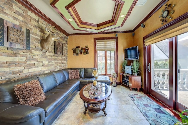 living room with plenty of natural light and crown molding