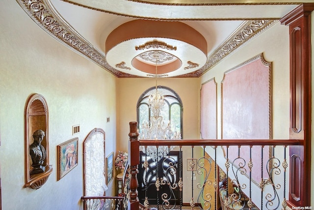 interior space featuring ornamental molding and a notable chandelier