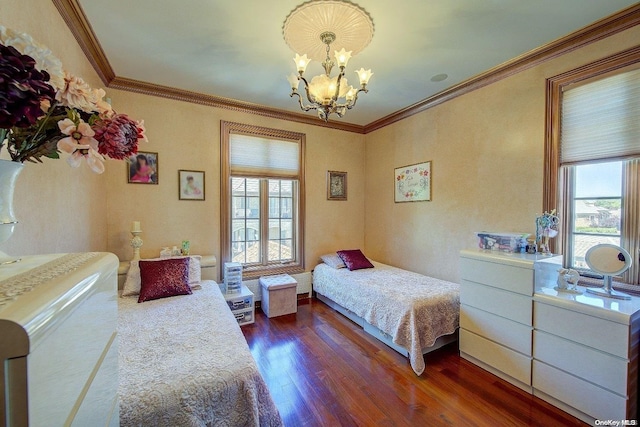 bedroom with dark hardwood / wood-style floors, an inviting chandelier, multiple windows, and ornamental molding