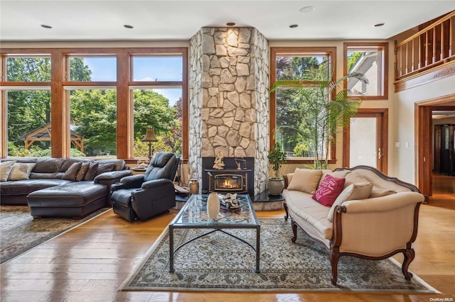 living room featuring hardwood / wood-style flooring and a wood stove