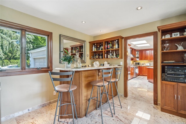 bar featuring stainless steel range