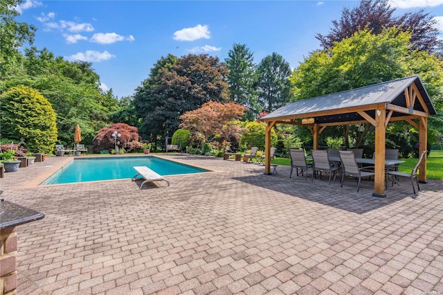 view of pool featuring a gazebo, a diving board, and a patio