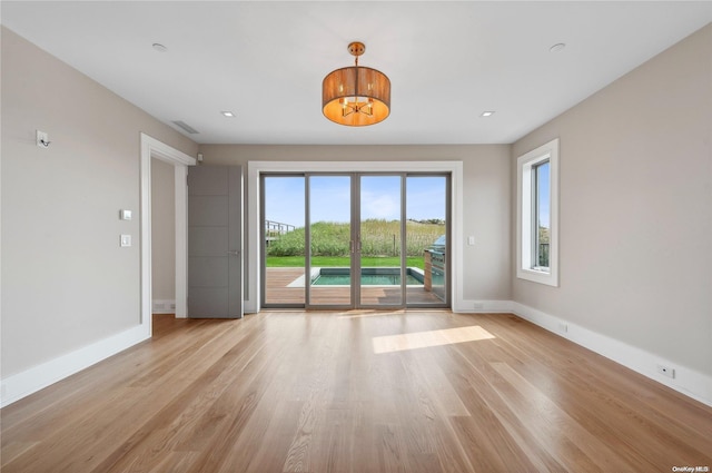 451 Dune Rd, Westhampton Beach, NY 11978 - unfurnished room featuring baseboards, light wood-style flooring, and recessed lighting