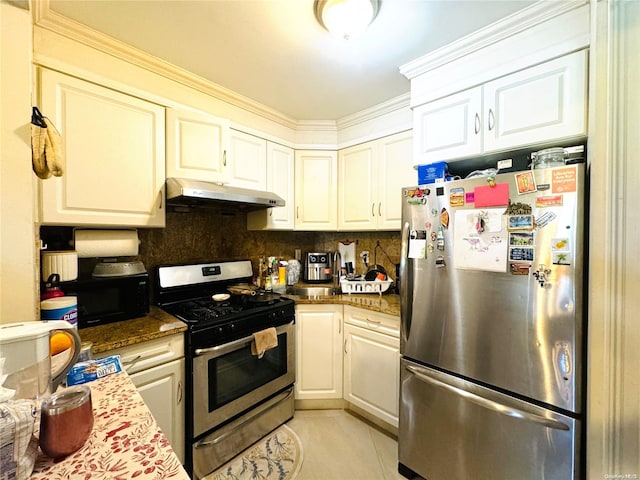 kitchen with white cabinetry, decorative backsplash, light tile patterned flooring, and stainless steel appliances