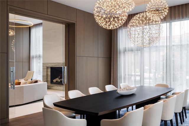 dining area featuring dark hardwood / wood-style flooring and a chandelier