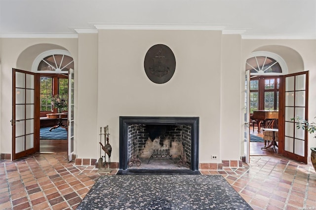 interior details featuring french doors and ornamental molding