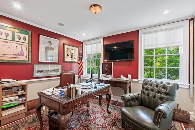 home office with hardwood / wood-style flooring and crown molding