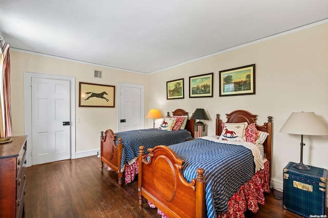 bedroom featuring dark hardwood / wood-style floors and crown molding