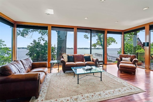 18 Hicks Ln, Sands Point, NY 11050 - sunroom with wood finished floors, expansive windows, a deck with water view, and recessed lighting