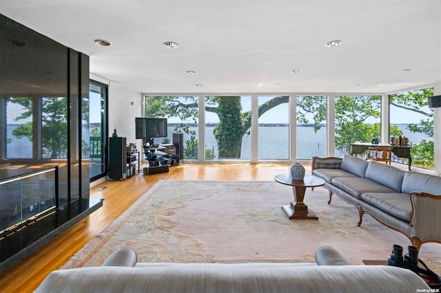 18 Hicks Ln, Sands Point, NY 11050 - living room with floor to ceiling windows, wood finished floors, and recessed lighting