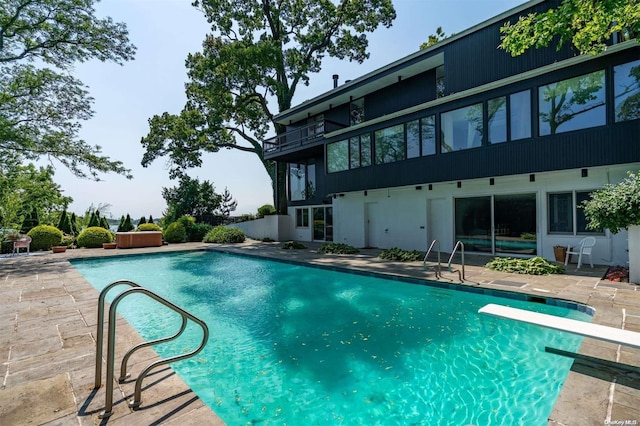 18 Hicks Ln, Sands Point, NY 11050 - outdoor pool with a patio and a diving board