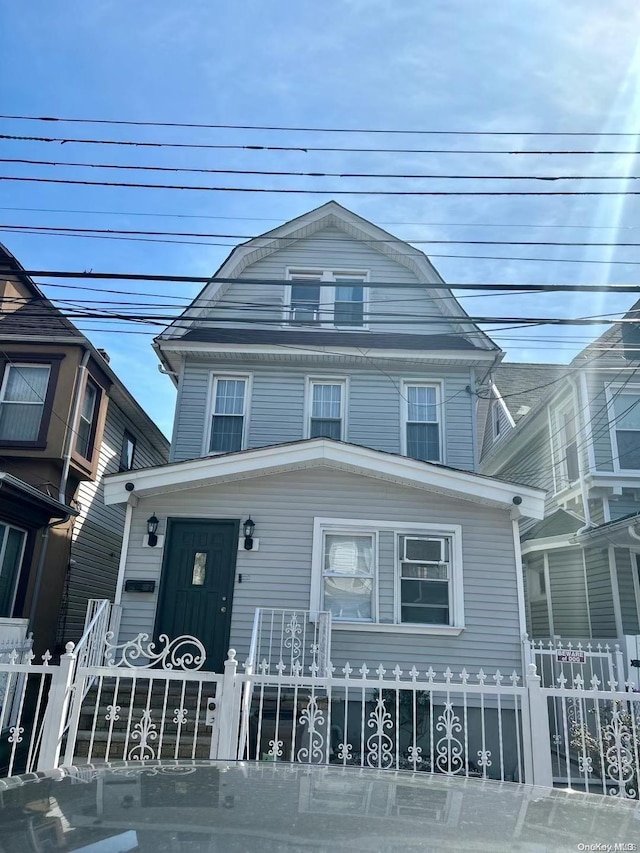 89-04 88th Ave, Woodhaven, NY 11421 - view of front of house with a fenced front yard