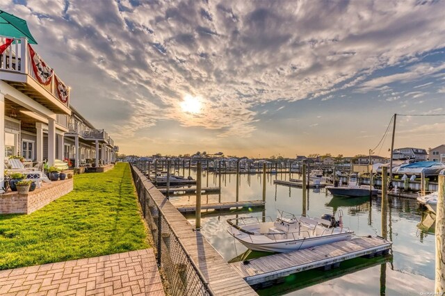 16 Ocean Watch Ct Unit 16, Freeport, NY 11520 - dock featuring a water view and a lawn