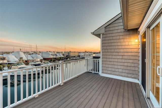16 Ocean Watch Ct Unit 16, Freeport, NY 11520 - deck at dusk with a water view
