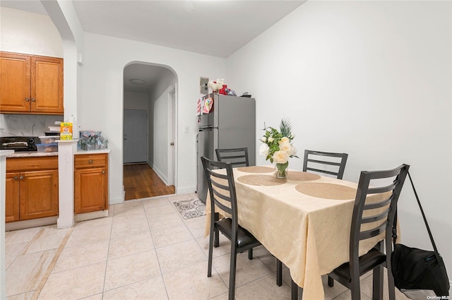 dining room featuring light tile patterned floors