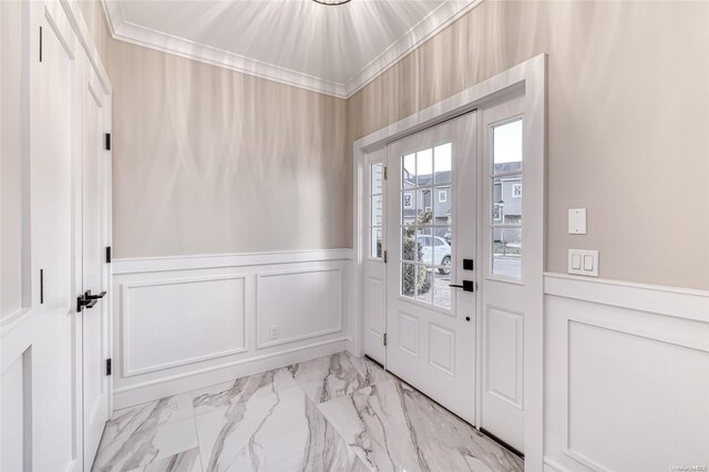 doorway to outside featuring ornamental molding