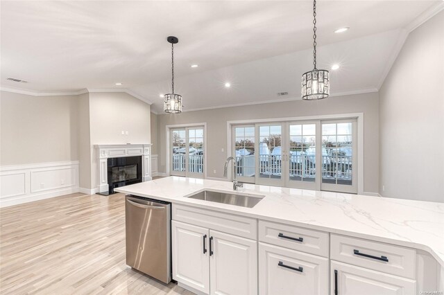 kitchen featuring white cabinetry, dishwasher, sink, light hardwood / wood-style flooring, and ornamental molding