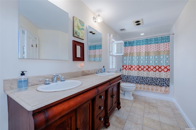 bathroom with tile patterned flooring, vanity, and toilet