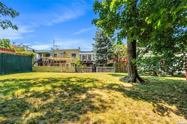 view of yard featuring a wooden deck