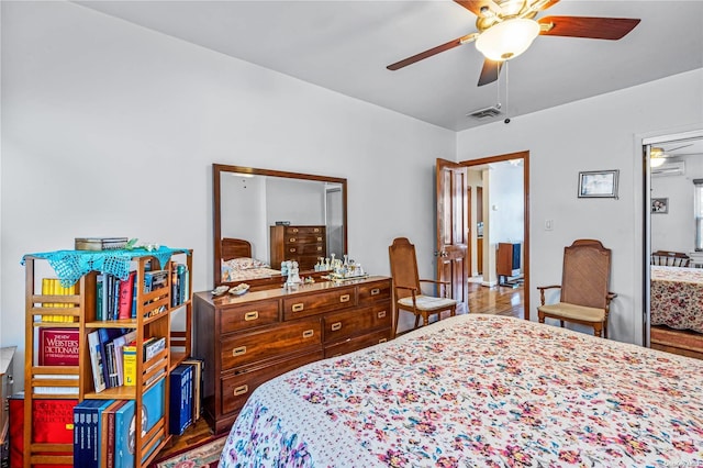 bedroom featuring ceiling fan and hardwood / wood-style flooring