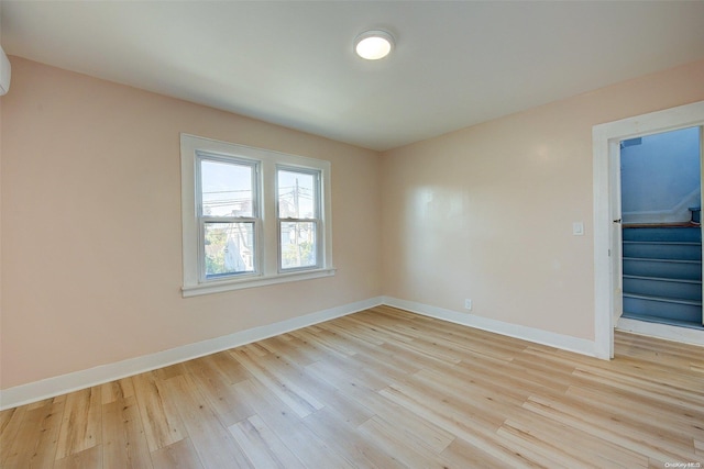 spare room with light wood-type flooring