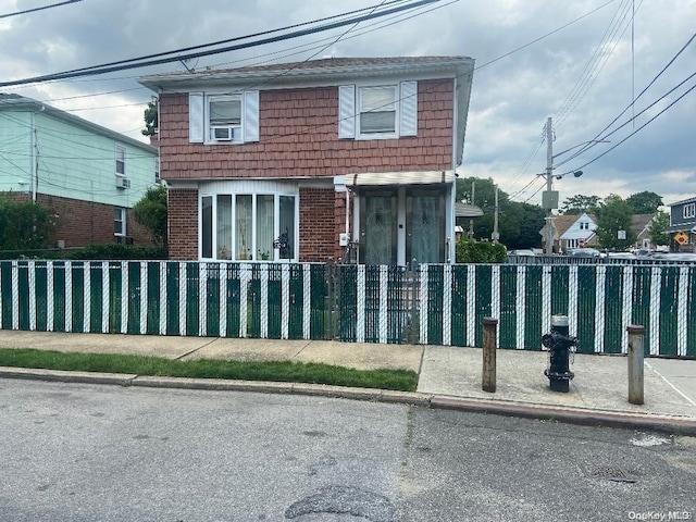 view of front of home featuring cooling unit