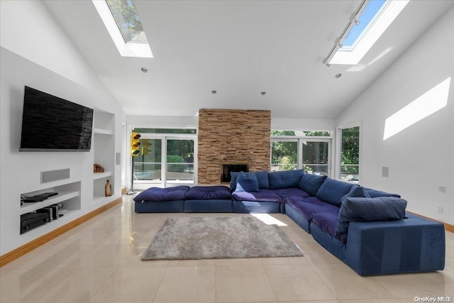 tiled living room with a fireplace, high vaulted ceiling, built in features, and a healthy amount of sunlight