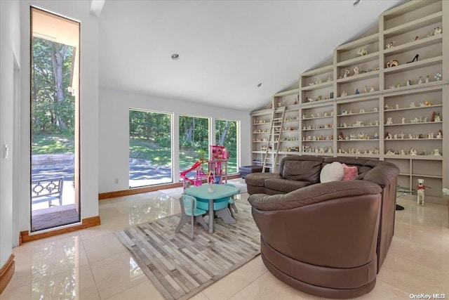 living room featuring light tile patterned floors and high vaulted ceiling