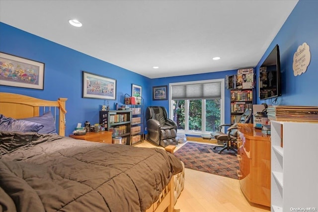 bedroom with light hardwood / wood-style flooring