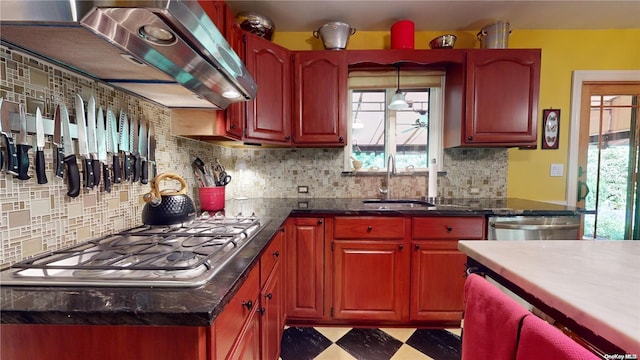 kitchen with wall chimney exhaust hood, decorative backsplash, sink, and stainless steel appliances