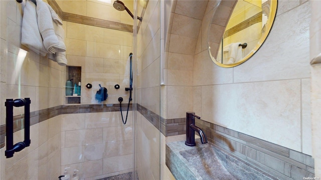 bathroom with a tile shower