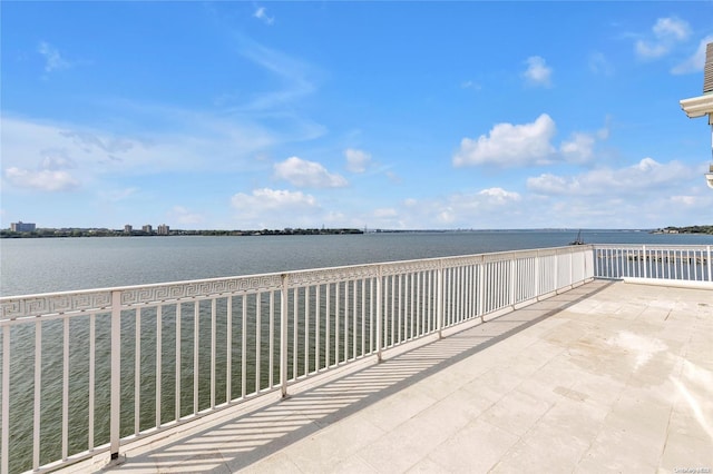 balcony featuring a water view