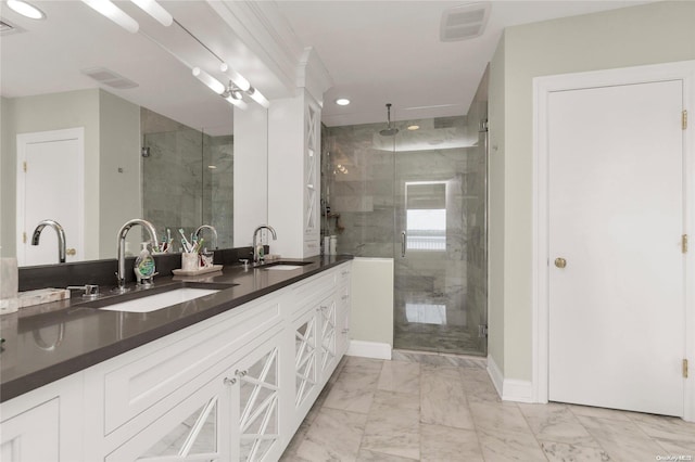 bathroom featuring walk in shower and vanity