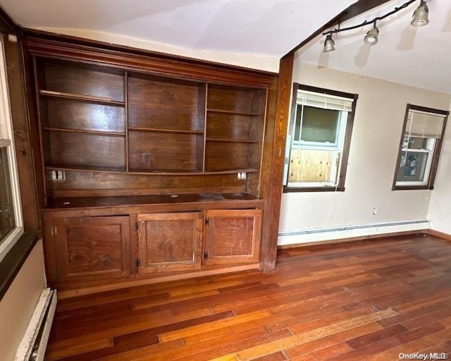 interior space featuring a baseboard radiator and hardwood / wood-style flooring