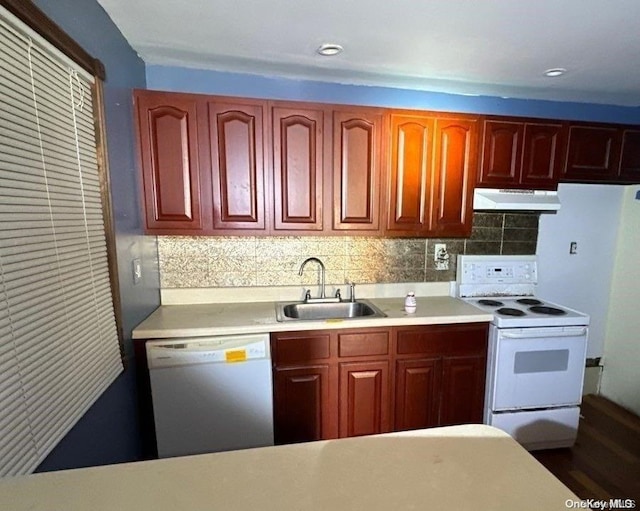 802 Lanark Rd, Broad Channel, NY 11693 - kitchen with white appliances, a sink, under cabinet range hood, light countertops, and tasteful backsplash