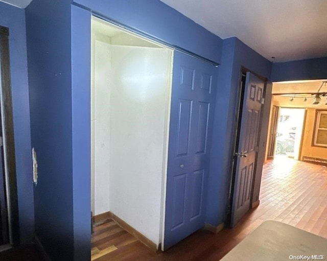 corridor featuring hardwood / wood-style flooring