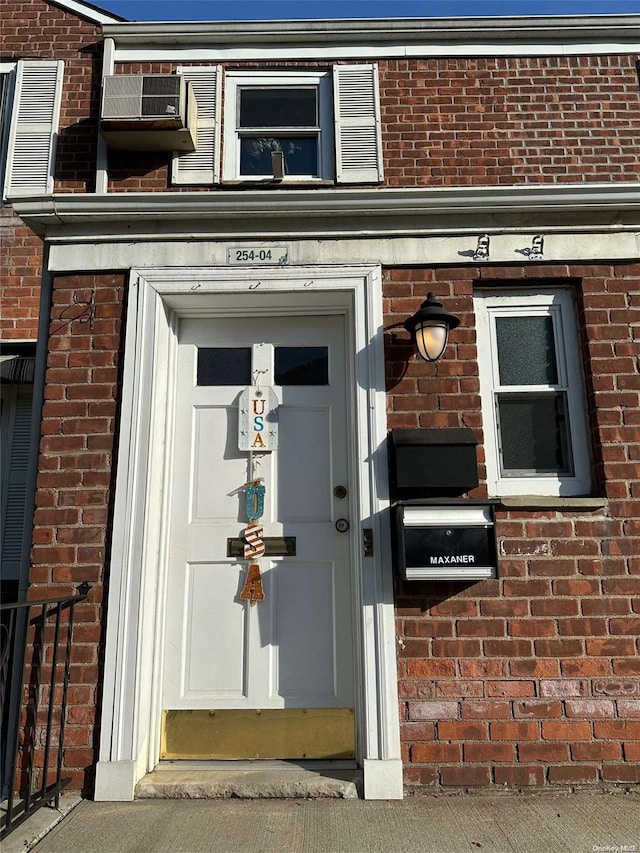 entrance to property with brick siding