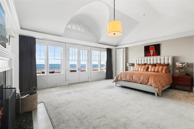 carpeted bedroom featuring a water view and vaulted ceiling