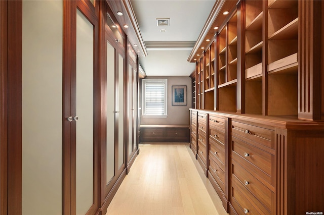 spacious closet featuring light hardwood / wood-style floors