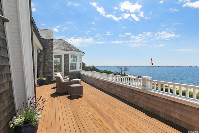 wooden deck featuring a water view