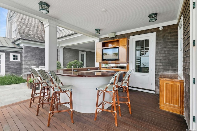 wooden deck with an outdoor bar