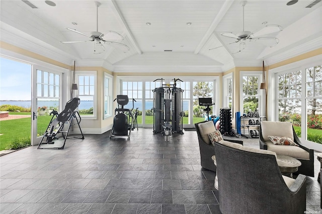 interior space with ceiling fan, a water view, and lofted ceiling with beams