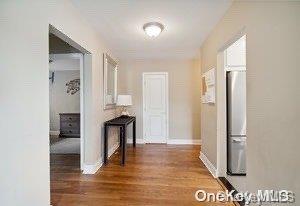 hall with dark hardwood / wood-style flooring