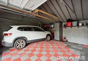 garage featuring a carport