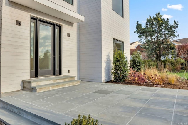 doorway to property featuring a patio