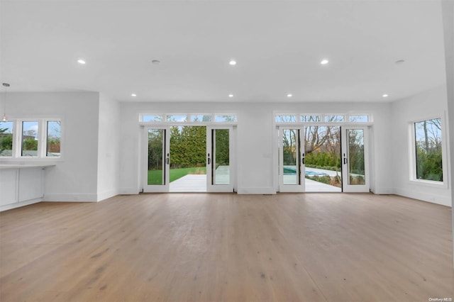 unfurnished living room with light hardwood / wood-style floors