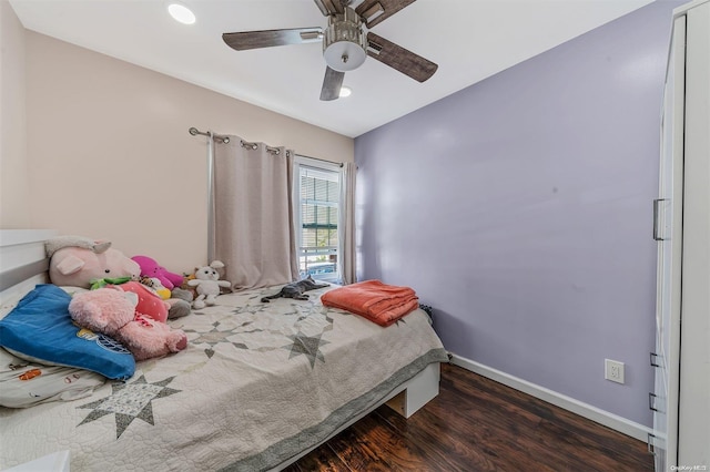 bedroom with ceiling fan and dark wood-type flooring