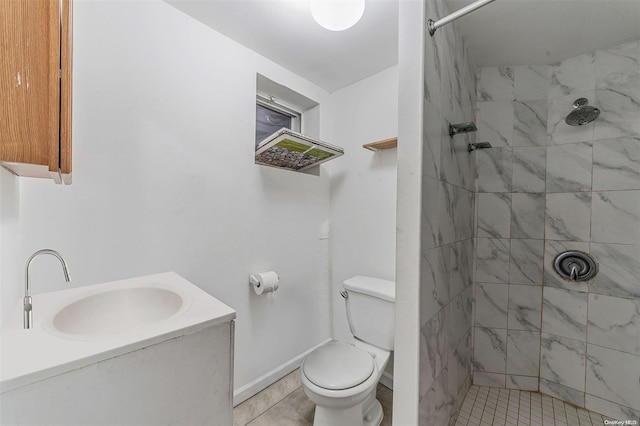 bathroom with tile patterned flooring, a tile shower, vanity, and toilet